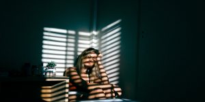 distraught girl in corner of room - Springfield domestic assault attorney