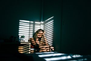 distraught girl in corner of room - Springfield domestic assault attorney