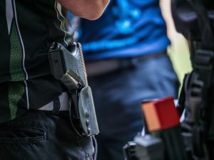 pistol in holster - Springfield firearm attorney