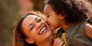man and son smiling into the camera